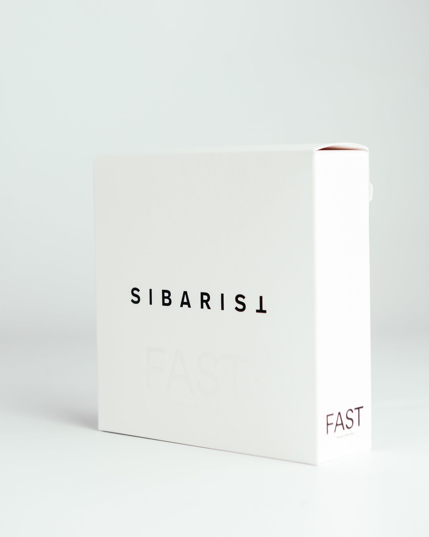 White coffee filter packaging with 'SIBARIST' and 'FAST' text on a light gray background
