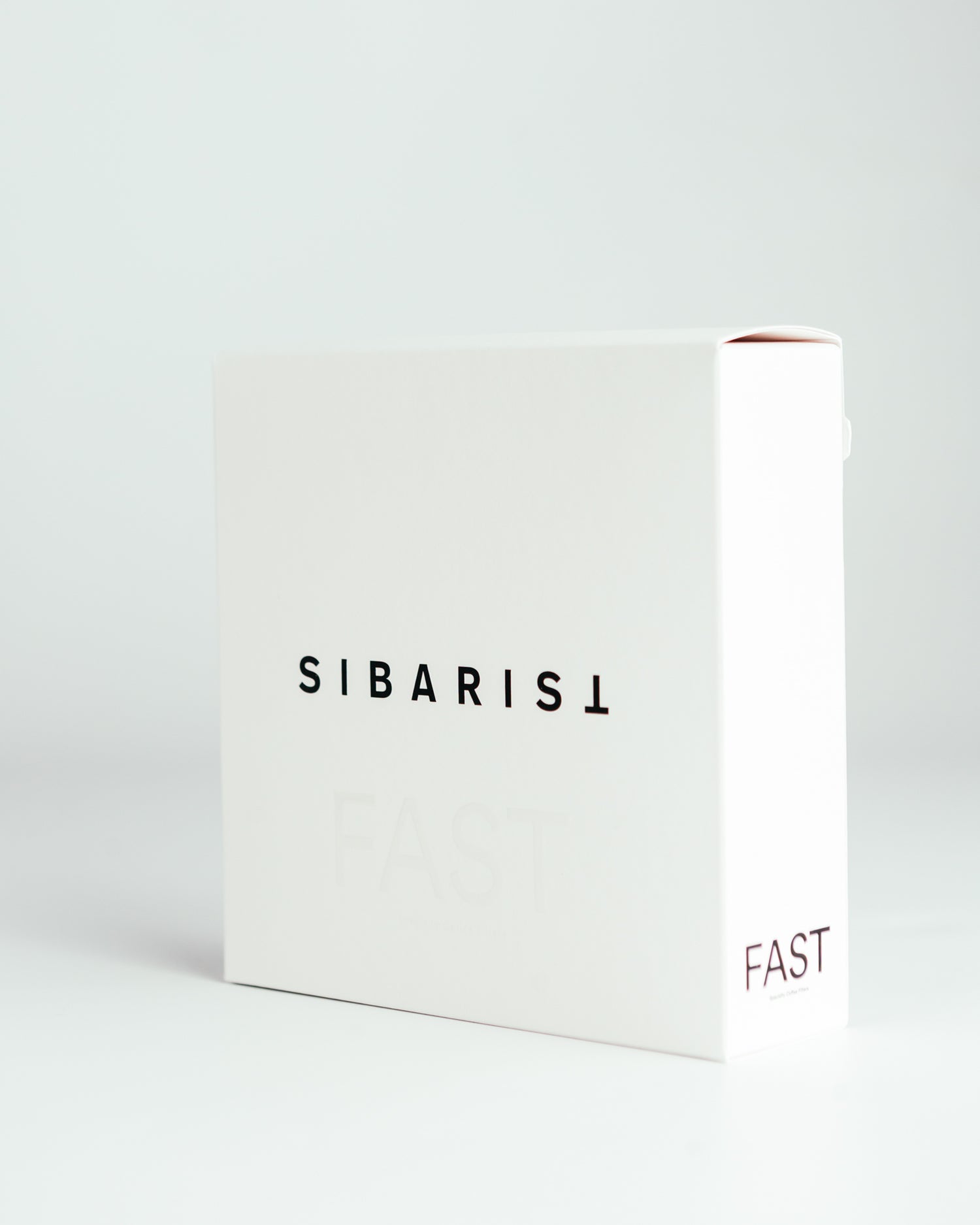 White coffee filter packaging with 'SIBARIST' and 'FAST' text on a light gray background